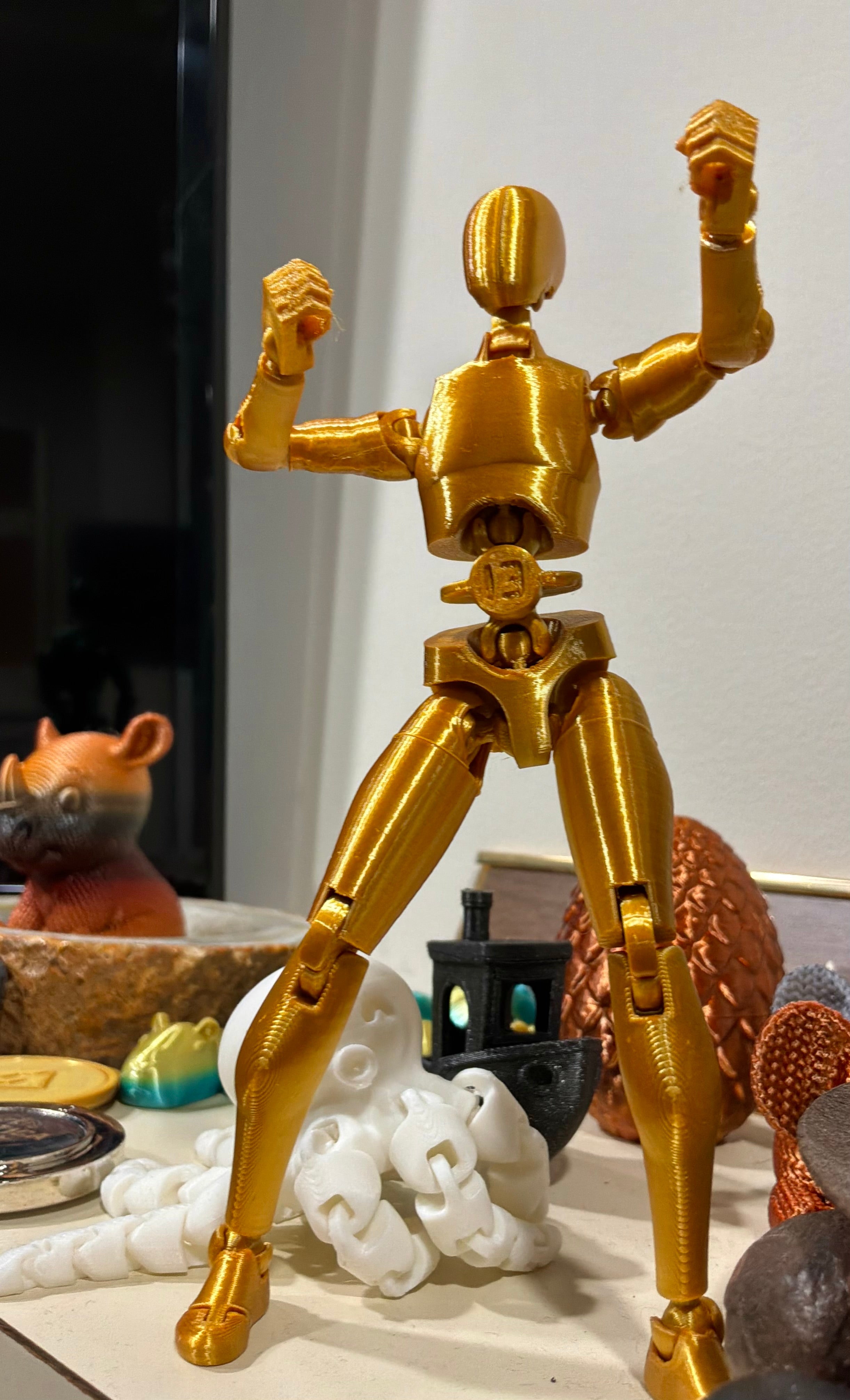 Lucky Swap Bot Gold — gold-on-gold articulated 1-of-1 figure, first drop