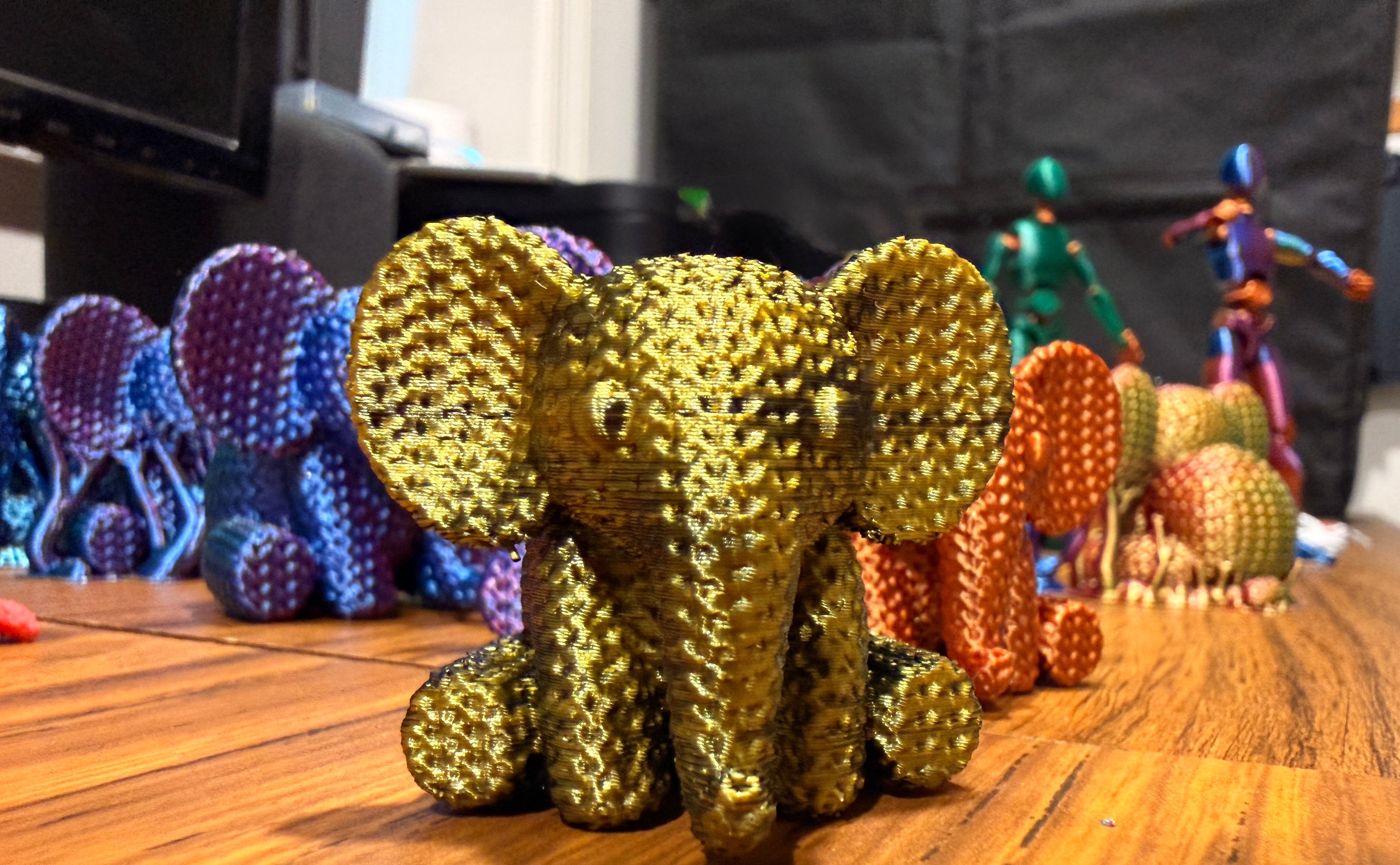 The Gold/Black Elephant 75% size, gold-with-dark-streaks silk PLA