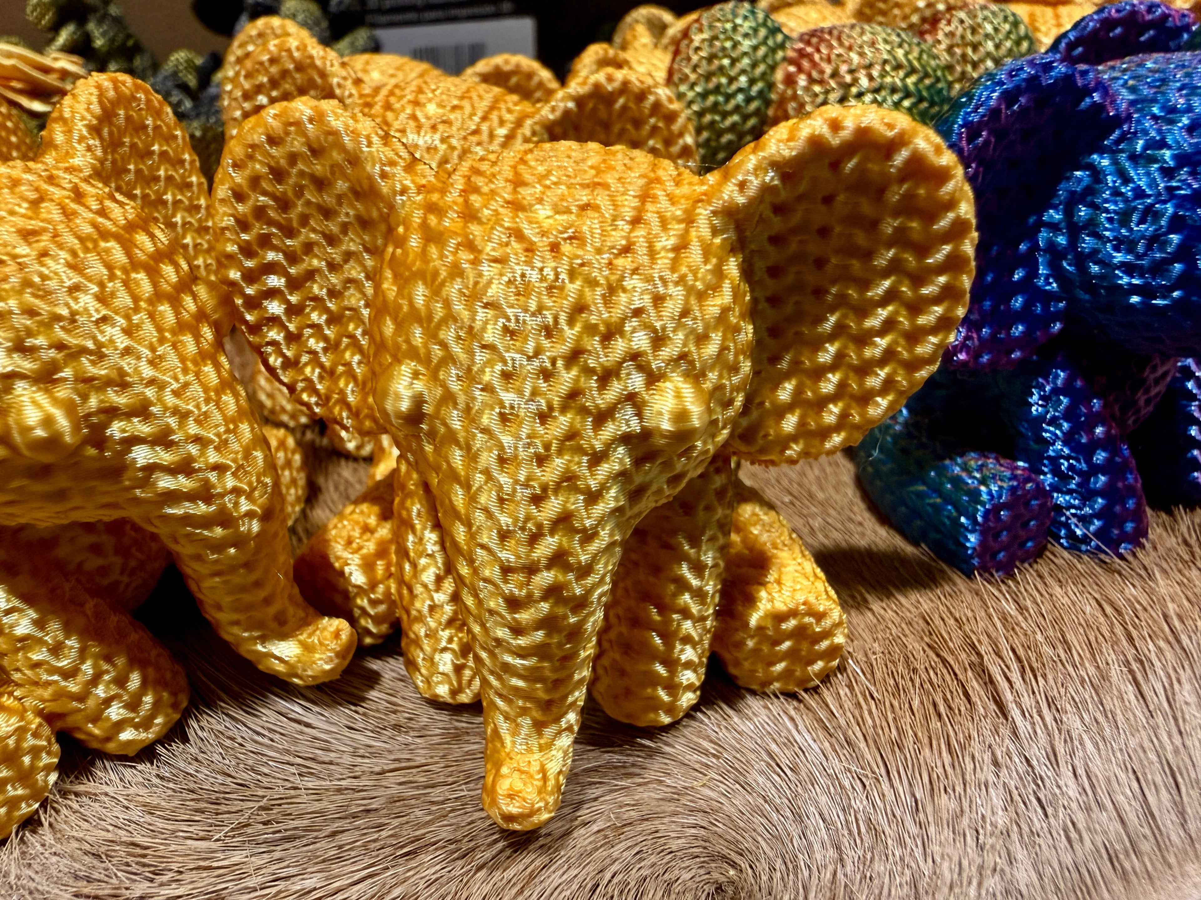 The Gold Elephant 100% size hero shot, gold silk PLA knurled texture